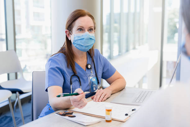 istock Gynecologist meets with patient 1386902452