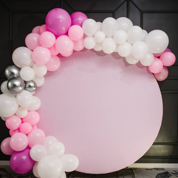istock Arch decorated with pink, white, and silver balloons for the wedding ceremony. Celebration concept. Trendy decor and photo wall. Copy space. A place for text. 1386902806