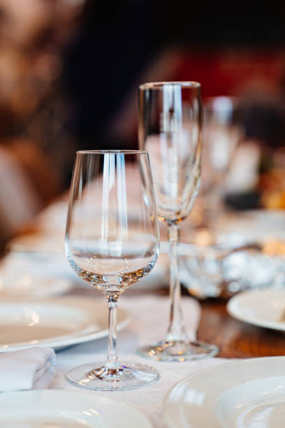 istock empty wine glasses on the table served for the holiday in the restaurant. 1386903541