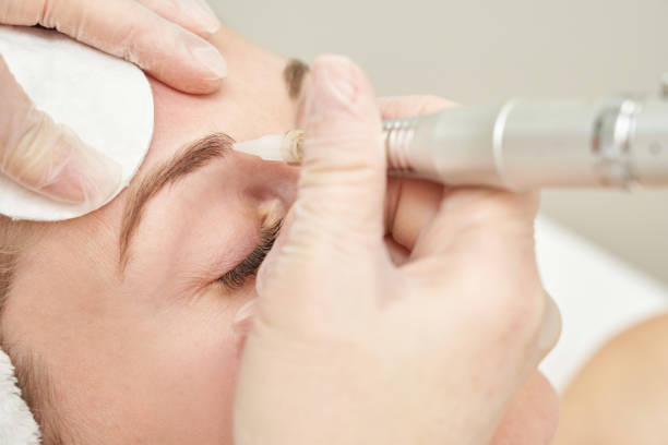istock Permanent makeup. Beauty spa procedure. young woman. Face tattoo 1386903775