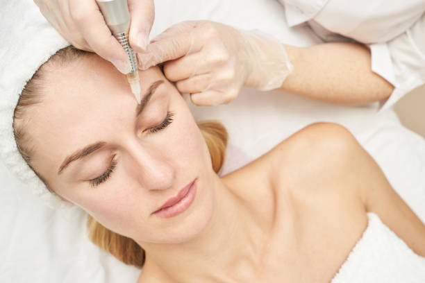 istock Permanent makeup. Beauty spa procedure. young woman. Face tattoo 1386903781