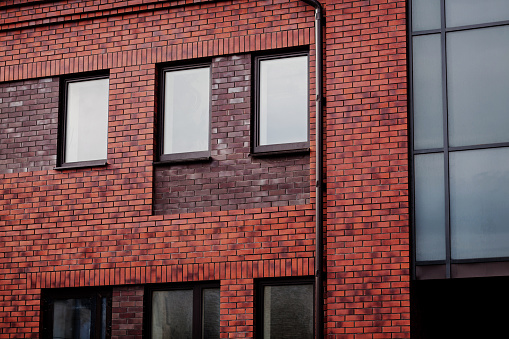 Red brick wall of a modern building in city
