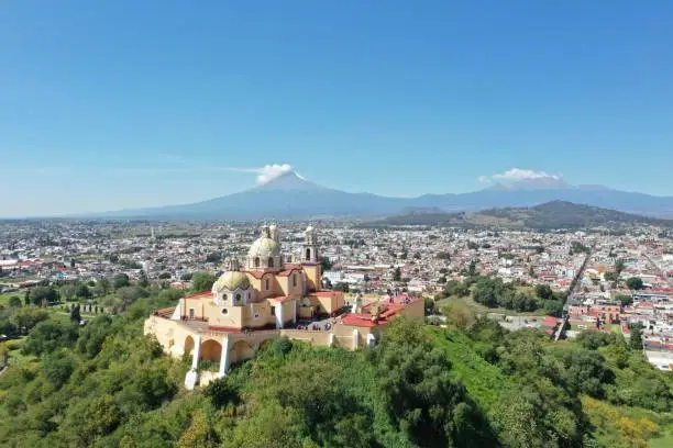 Cholula is a small town in Mexico, outside Puebla, with its beautiful cathedral overlooking the mountains.