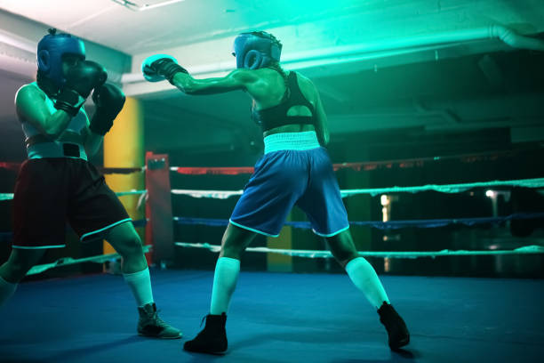 istock Strong boxer girls fighting for victory on ring 1386907046