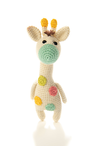 Amigurumi crochet giraffe isolated on white background