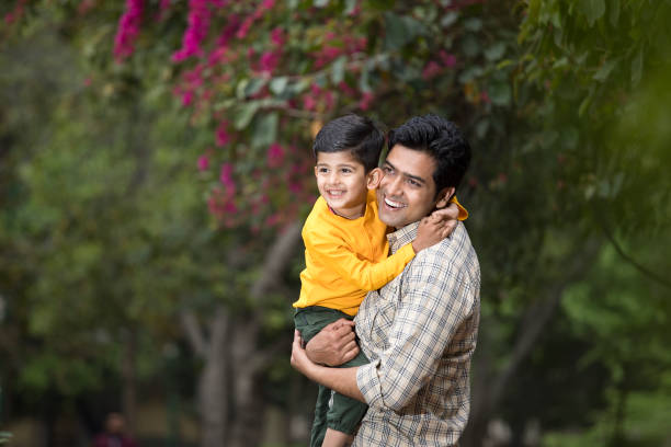 istock Father with son admiring view at park 1386910185