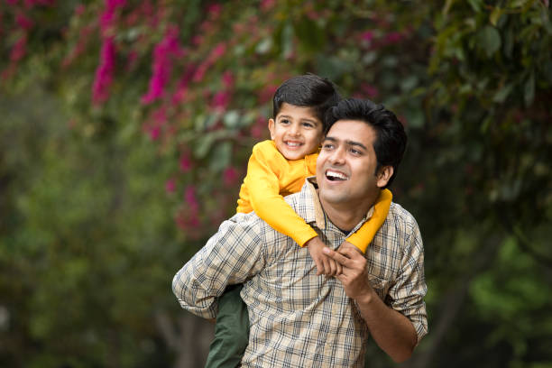 istock Father with son admiring view at park 1386910216