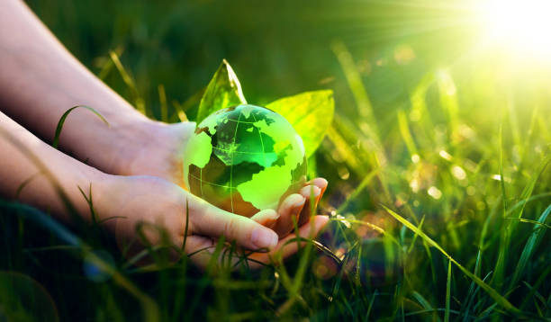 istock Earth Day. Environment day, save clean planet, ecology concept. Renewable energy-based green businesses can limit climate change and global warming. 1386910435