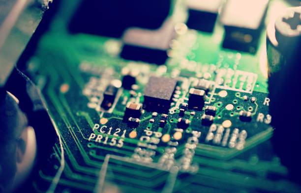 istock Old dusty and dirty laptop circuit board close-up 1386910699