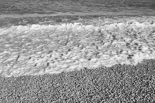 Mediterranean pebble beach in Valencia. Spain. Black and white