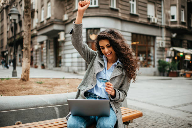 istock Girl enjoying outdoors and using a laptop 1386911665