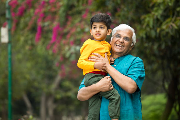 istock Old man enjoying with grandson at park 1386914809