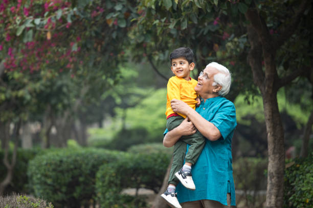 istock Old man enjoying with grandson at park 1386914983