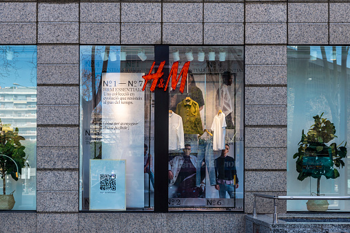 Barcelona, Spain - February 24, 2022: Facade of a HM or H&M clothing store in Diagonal avenue, a shopping street of Barcelona, Catalonia, Spain