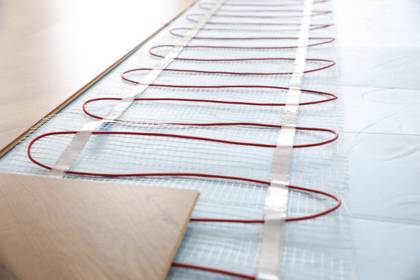 Installation of modern underfloor trace heating system indoors, closeup