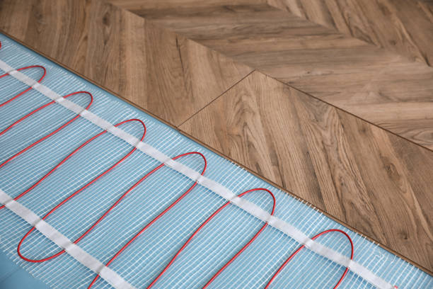 Installation of modern underfloor trace heating system indoors
