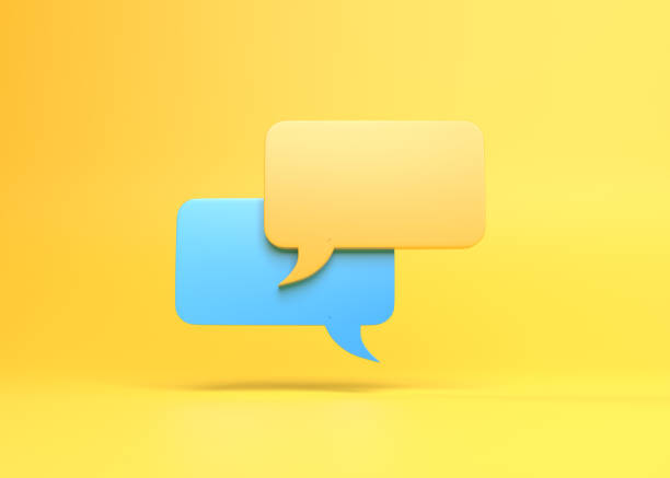 istock 3D Minimal yellow and blue chat bubbles isolated on a yellow background with copy space 1386921074