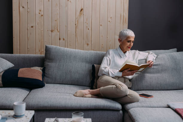 istock A Beautiful Elegant Senior Woman Reading Her Diary While Relaxing At Home 1386923727