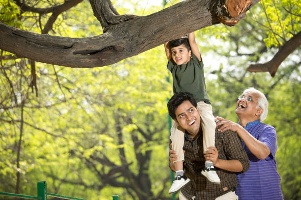 istock Three generation family having fun at park 1386925570