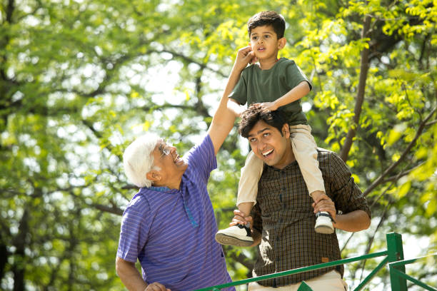 istock Three generation family having fun at park 1386925620