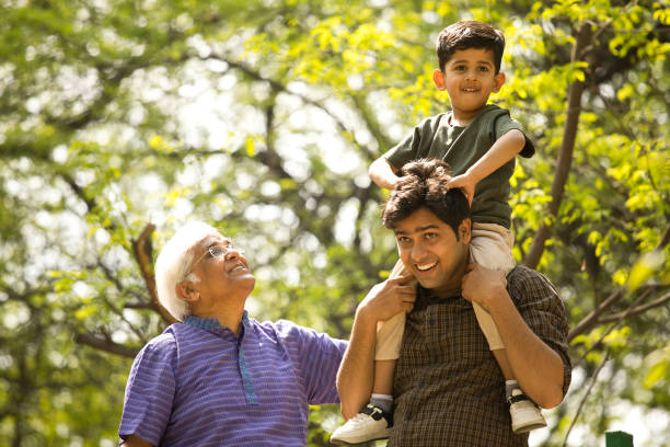 istock Three generation family having fun at park 1386925659