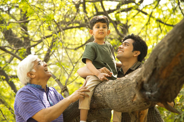 istock Three generation family having fun at park 1386926208