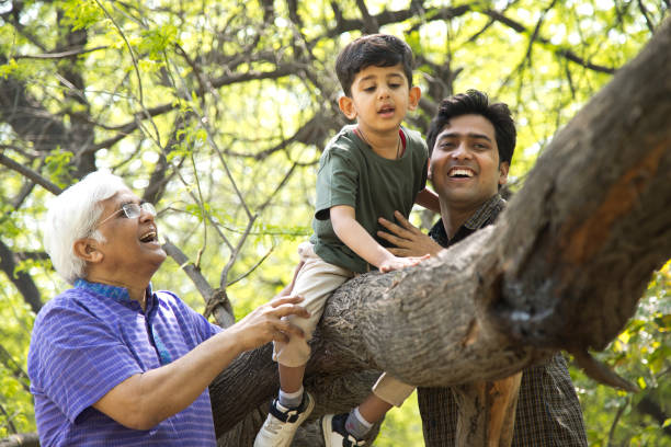 istock Three generation family having fun at park 1386926242