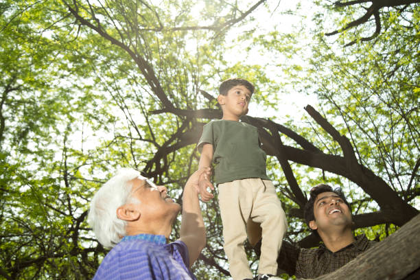 istock Three generation family having fun at park 1386926798