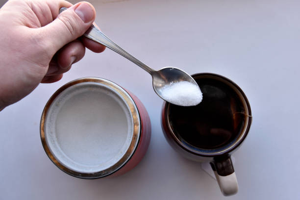 istock Sugar bowl with a spoon and a mug of tea 1386927640