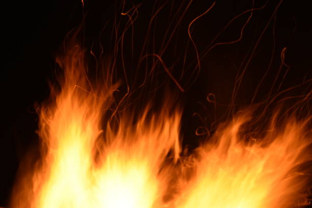 istock Close-up of flames with sparks in movement 1386930203