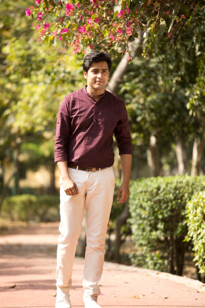istock Happy man walking at park 1386931964