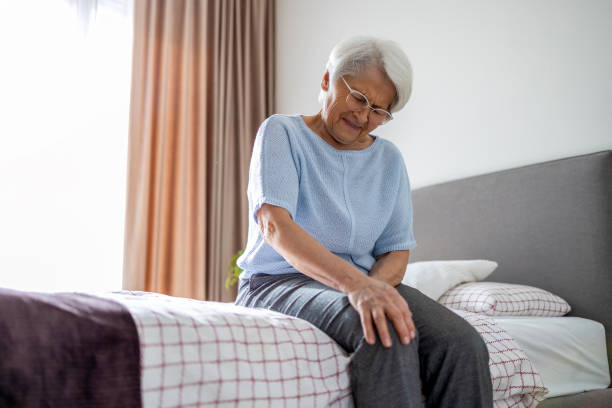 Senior woman with knee pain stock photo