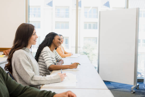 istock Classmates sitting in the front row of class 1386939542