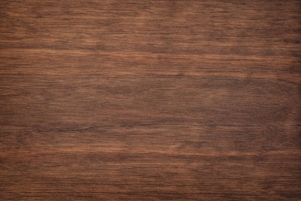 istock dark wood texture in walnut color. empty surface rustic table background. mahogany template for design 1386942263
