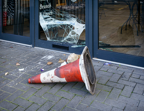 Opportunistic burglars have broken into a suburban cafe, using a rock to break the glass.