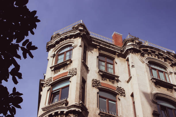 istock vintage build and tree blue sky 1386945651