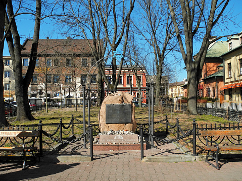 Krakow, Poland - March 21, 2022: Monument in old Jewish quarter Kazimierz - stone commemorating Jews killed by Nazis during the Holocaust of World War II