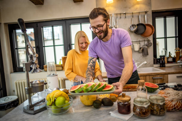 istock Young couple making breakfast at home 1386949527