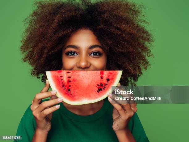 Studio Portrait Of A Beautiful Afro Girl With Watermelon Stock Photo - Download Image Now