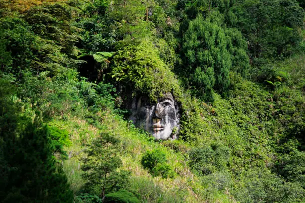 North Sulawesi, Indonesia, June 17, 2015. Carved faces of Toar Minahasa ancestral figure in Bukit Kasih complex. Toar is believed to be one of the people who first set foot on the land of Minahasa.