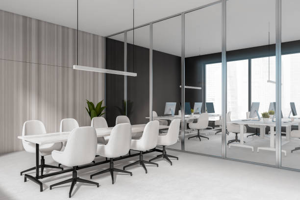 istock Corner view on dark office room interior with meeting board 1386953090
