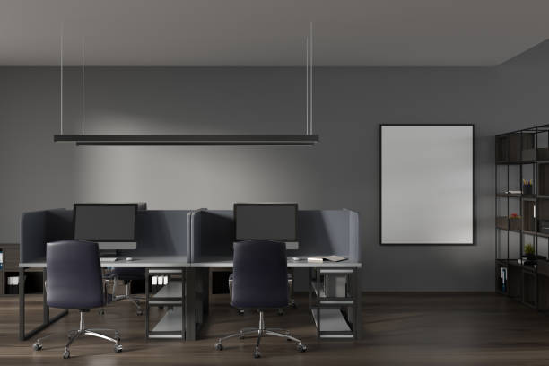 istock Dark office room interior with empty white poster, desktops 1386953205