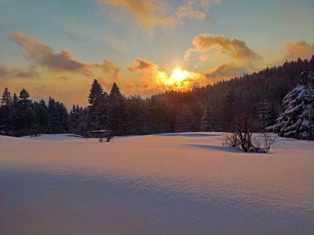 istock Golden hour on snow landscape 1386954675