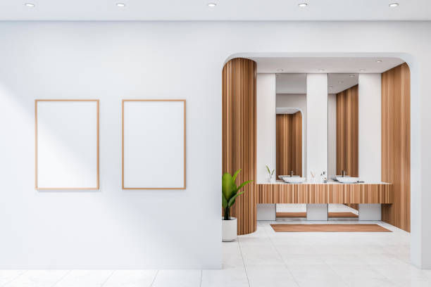 istock Light bathroom interior with sink and mirror, plant on tiled floor. Mockup posters 1386955705