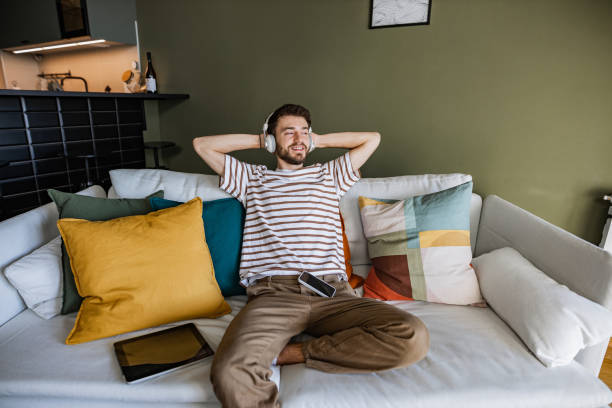 istock Young man relaxing at home 1386960417