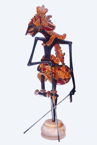 A wooden puppet souvenir with a beautiful batik motif A wooden puppet souvenir with a beautiful batik motif, looks luxurious when displayed in a room. Very creative handicraft products. wayang kulit stock pictures, royalty-free photos & images