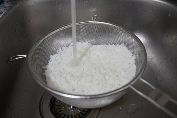 istock Cold water tap cooling the freshly cooked rice 1386963231