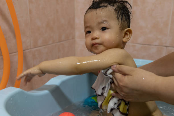istock Happy 1 years old Asian Chinese boy happy during bathing 1386964299