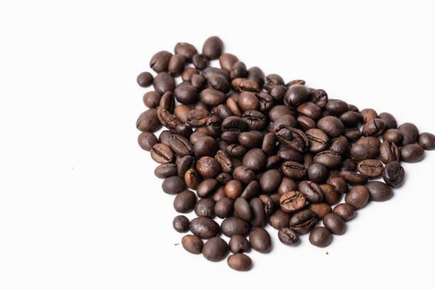 istock Close-up Roasted coffee beans on white background. 1386964312