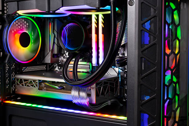 istock Inside view black high end custom colorful illuminated bright rainbow RGB LED gaming pc. Computer power hardware and technology concept background 1386965506